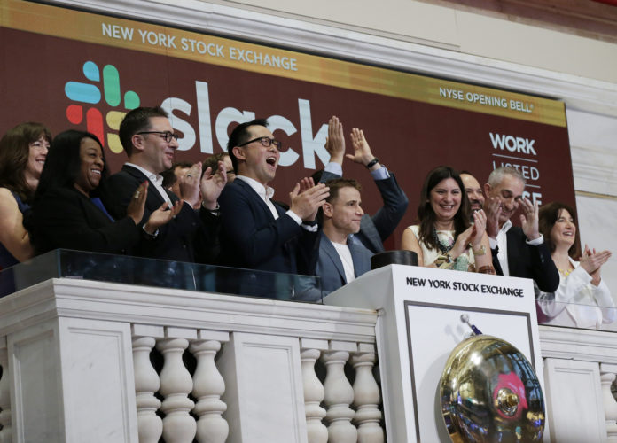 Slack CEO Stewart Butterfield along with other company representatives celebrate the companies IPO at the New York Stock Exchange in 2019