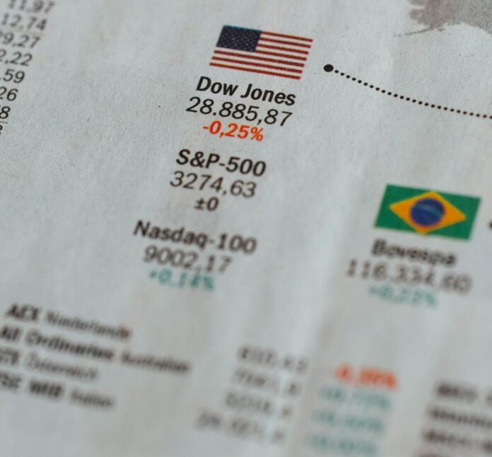Newspaper world stock exchange share price Dow Jones and Nasdaq